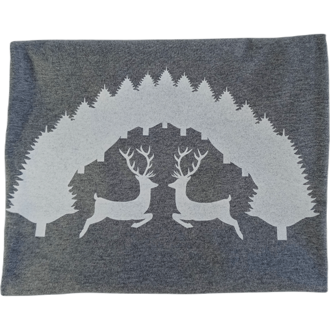 Close-up of a white screen-printed stag and pine tree design on a charcoal grey organic cotton t-shirt by SeaNic. Show the crisp detail acheived by hand screen printing