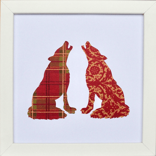 SeaNic handcrafted papercut wall art featuring two howling wolves. One wolf silhouette in red tartan and one in gold damask pattern. Sustainable nature-inspired home decor and unique wildlife gift.
