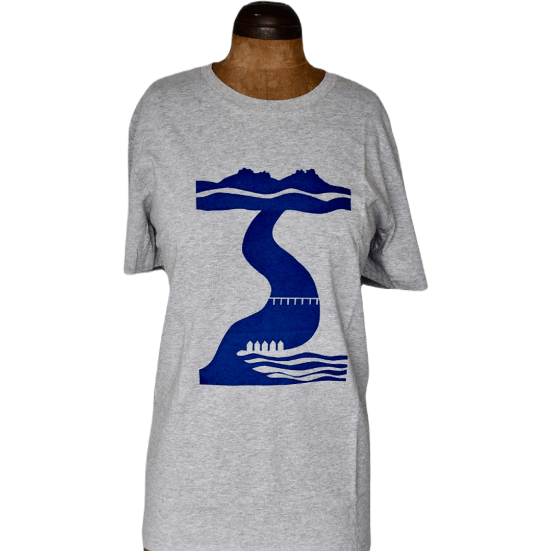 A full-length view of the Tor to Sea organic cotton t-shirt on a wooden mannequin. The image shows the relaxed fit of the grey heather fabric and the central placement of the navy blue Dartmoor-to-coast screen print.